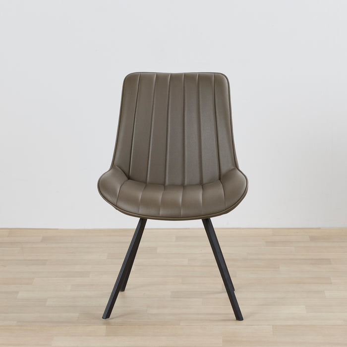 Brown chair with black legs on a wooden floor and light gray background