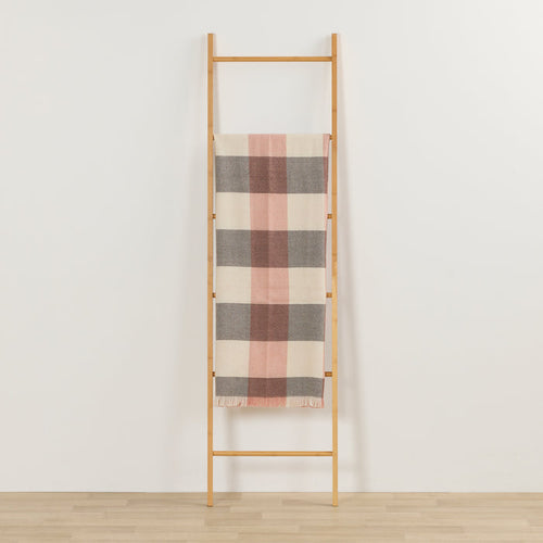 Tara Throw - Choco/Pink checked throw in chocolate, pink and cream draped over a timber ladder.
