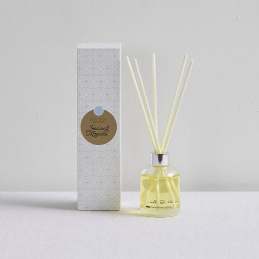 The Scent Collective Diffuser - Jasmine and Magnolia, floral reed diffuser with pale yellow fragrance oil and patterned box