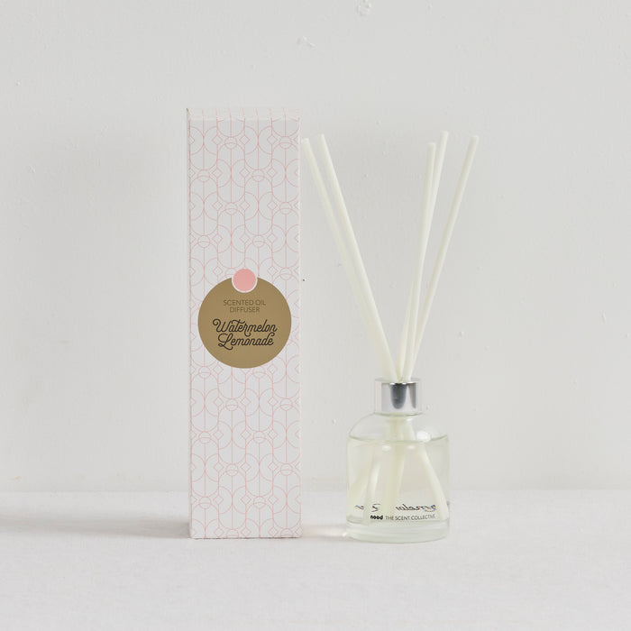 The Scent Collective Diffuser - Watermelon Lemonade, clear glass reed diffuser with pale fragrance oil and patterned box
