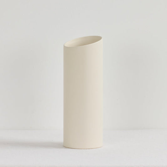 White ceramic vase on a light gray background
