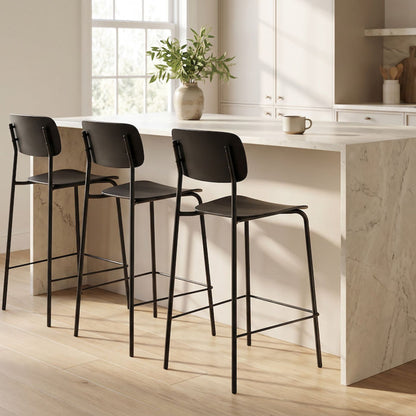 Vincent Counter Stool - Black with streamlined seat and backrest on slender black metal legs and footrest.