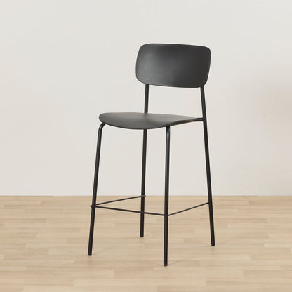 Vincent Counter Stool - Black with streamlined seat and backrest on slender black metal legs and footrest.
