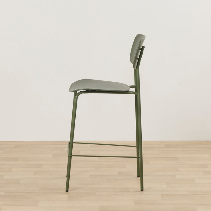 Vincent Counter Stool - Olive side view with olive padded seat, curved backrest and slim metal frame with footrest.