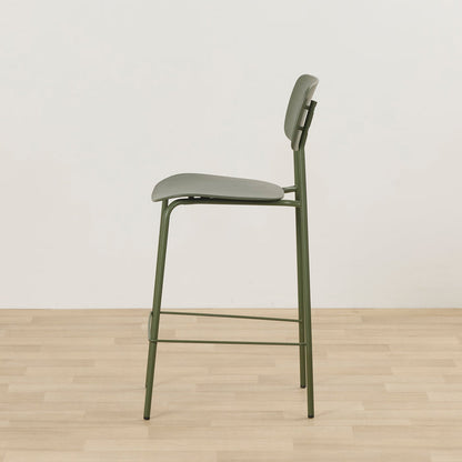 Vincent Counter Stool - Olive side view with olive padded seat, curved backrest and slim metal frame with footrest.