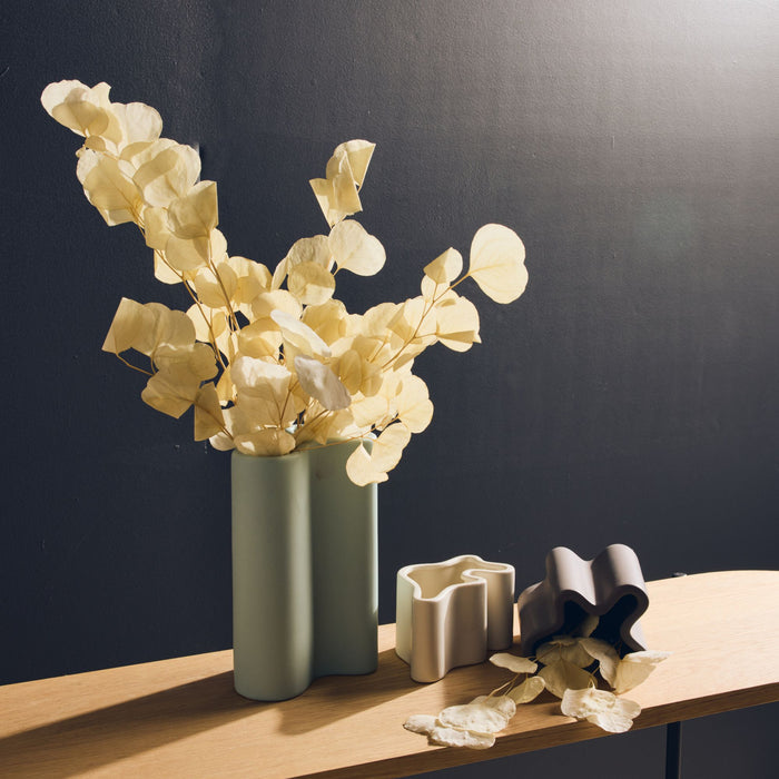 Wave Low Vase - Bone, low sculptural ceramic vase with wavy rim, styled on timber shelf with dried foliage