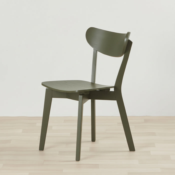An olive green wooden dining chair with a curved backrest and seat, shown on a light wood floor against a plain white wall.